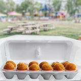 A white blank foam 12 egg carton being used for fried arancini balls at a fair