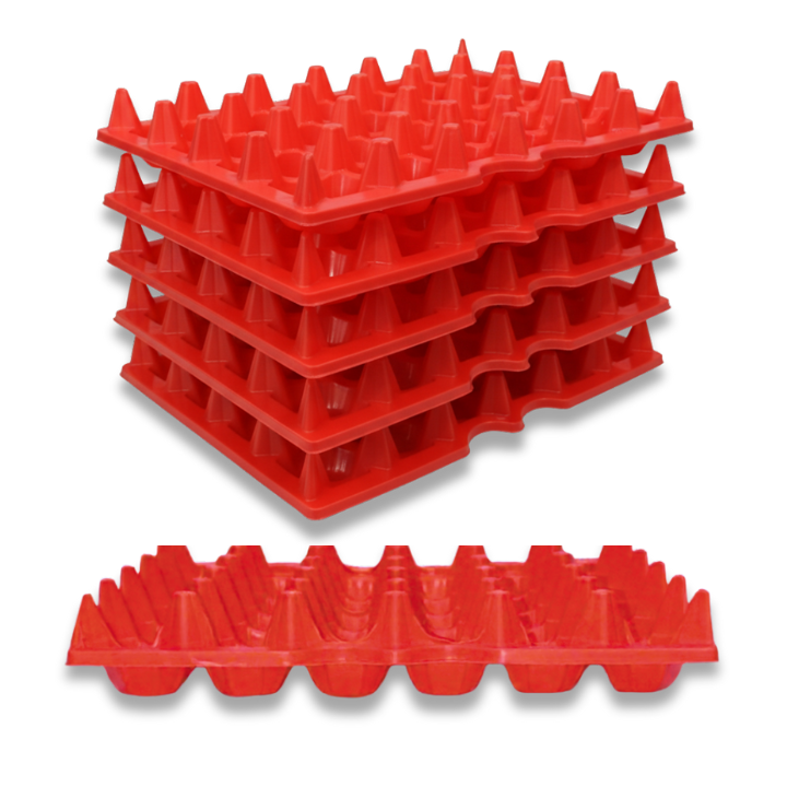 Stacked red plastic 30-cell plastic filler flat trays for machined parts organization or egg storage