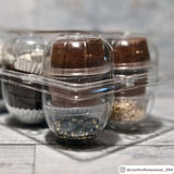 A clear plastic goose egg carton filled with brownies and chocolate desserts