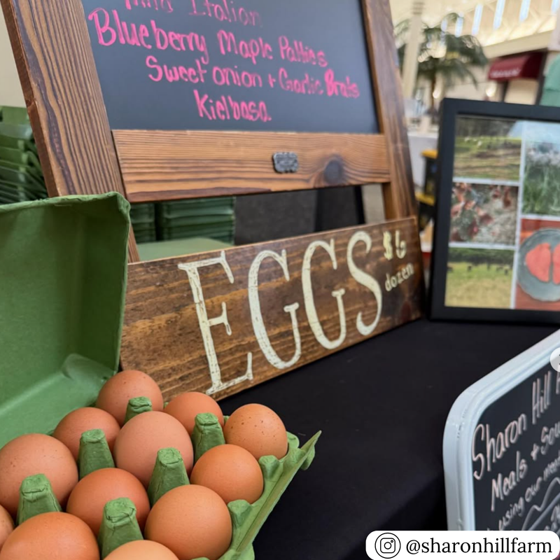 Army green vintage style carton of eggs with a wooden sign labeled &