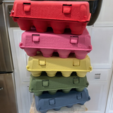 Red, yellow, pink, orange, green, and blue vintage colorful paper pulp egg cartons stacked, 12-egg, unprinted