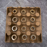 A 12 cell paper pulp tray made for organizing machined parts. 