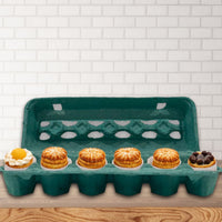 A teal paper pulp open stock egg carton filled with pastries, dessert packaging